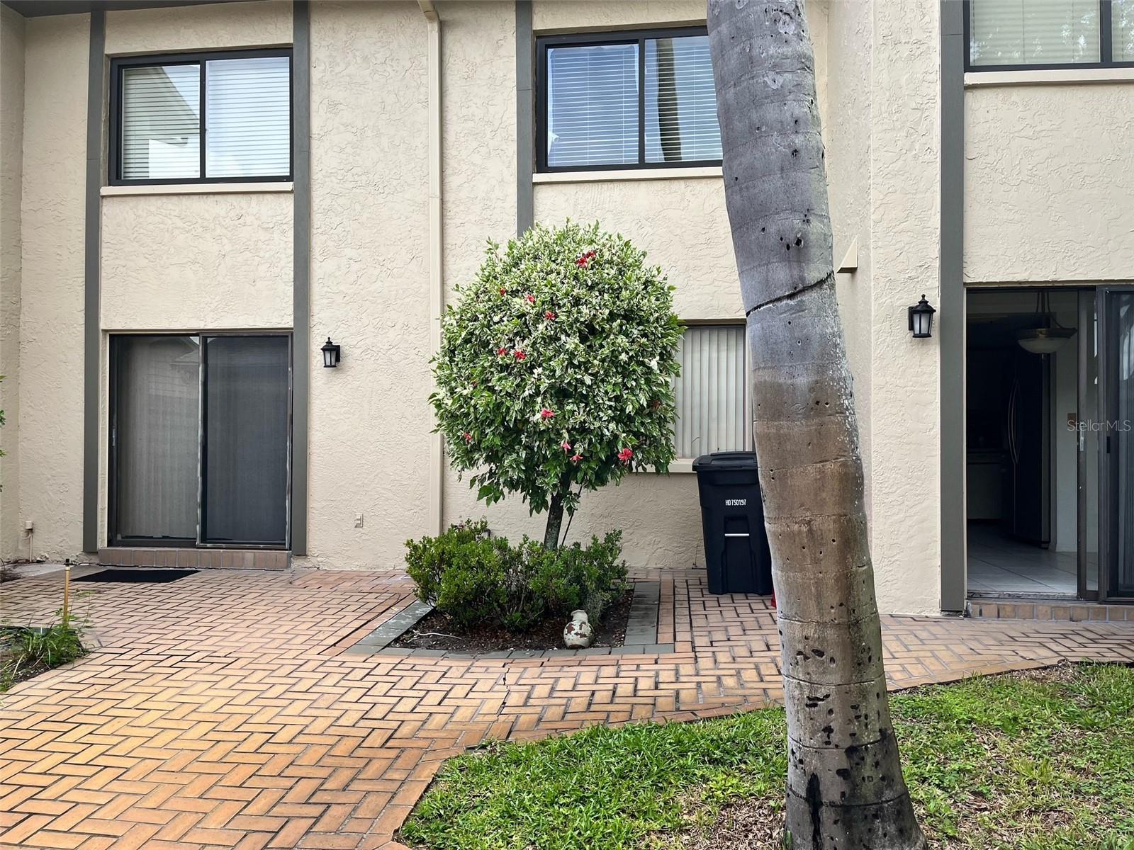 side patio with 2 glass doors