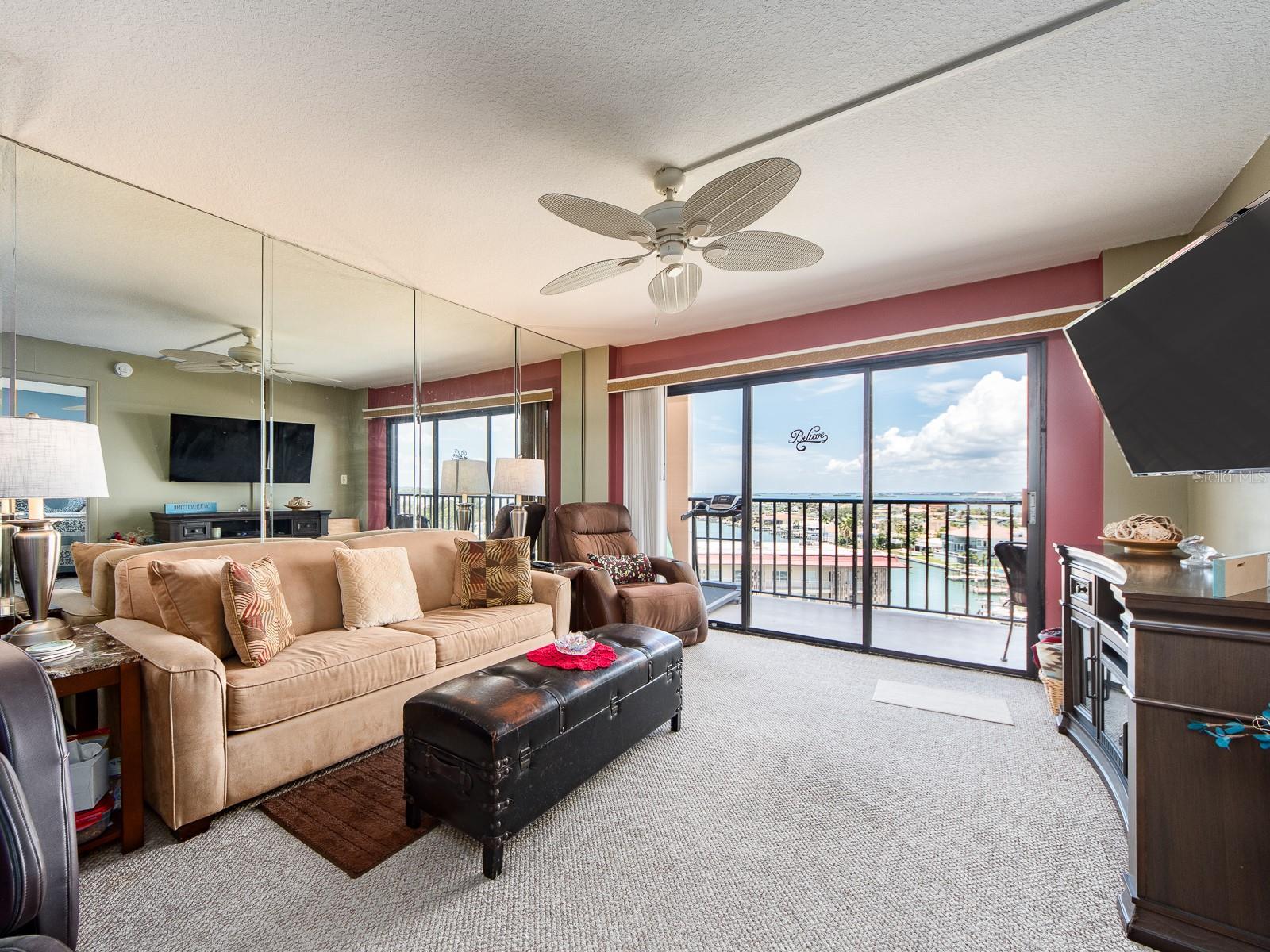 Living room opens to a large balcony