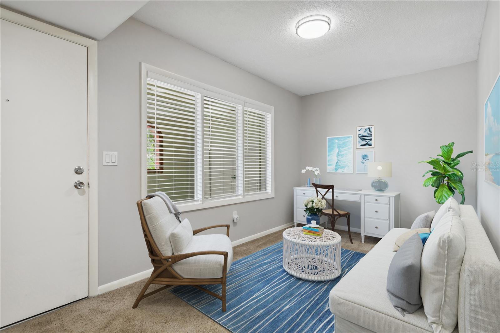 virtually staged front den/office/guest space