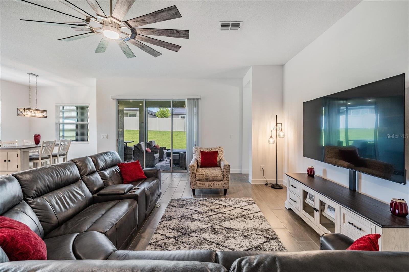 Slliders open to your covered and screened lanai