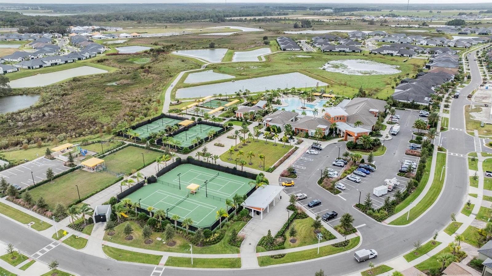 tennis & pickleball courts, dog park, playground, bocce ball, shuffleboard, clubhouse and pool