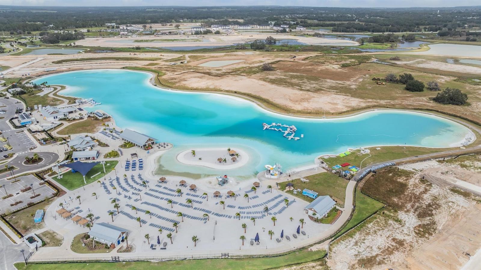White sandy beach area surrounds the 15 acre lagoon