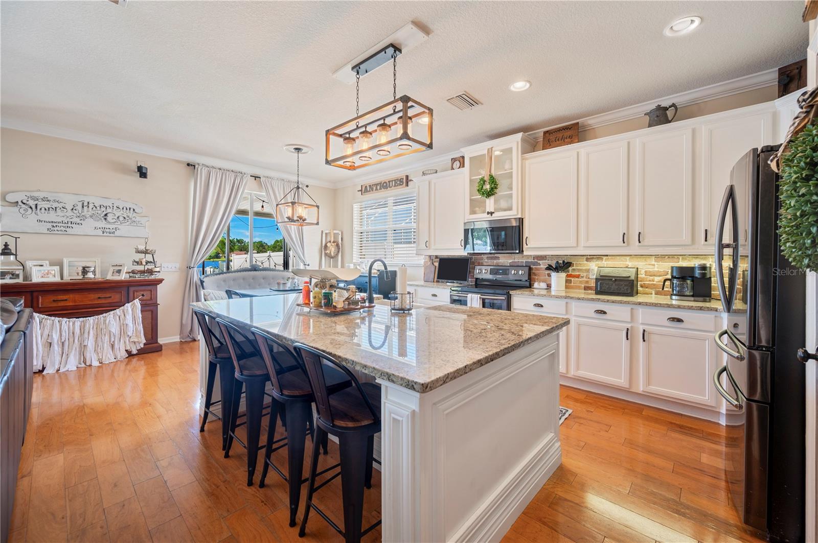 Cozy kitchen with white cabinetry.