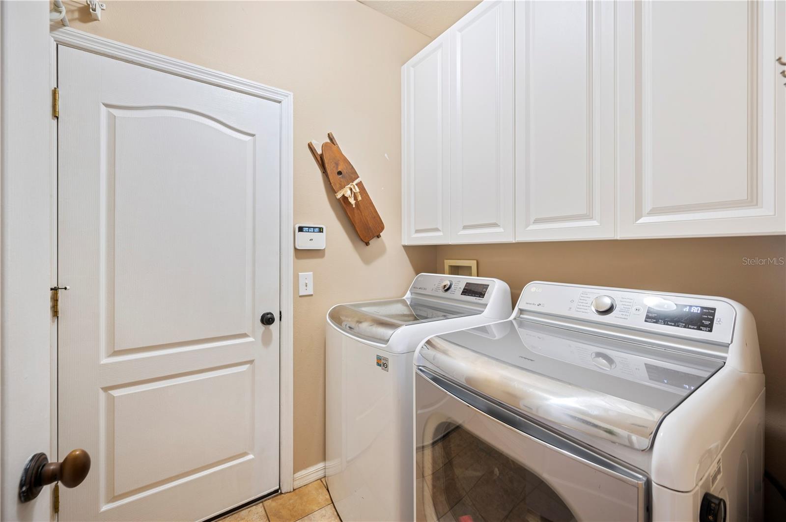 Laundry room with built in cabinets
