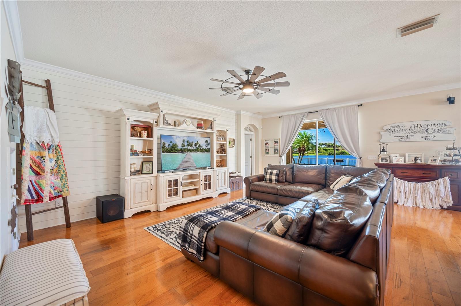 Grand Living room with shiplap wall.