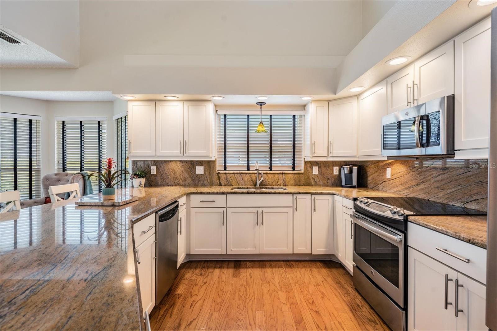 large kitchen with granite countertops