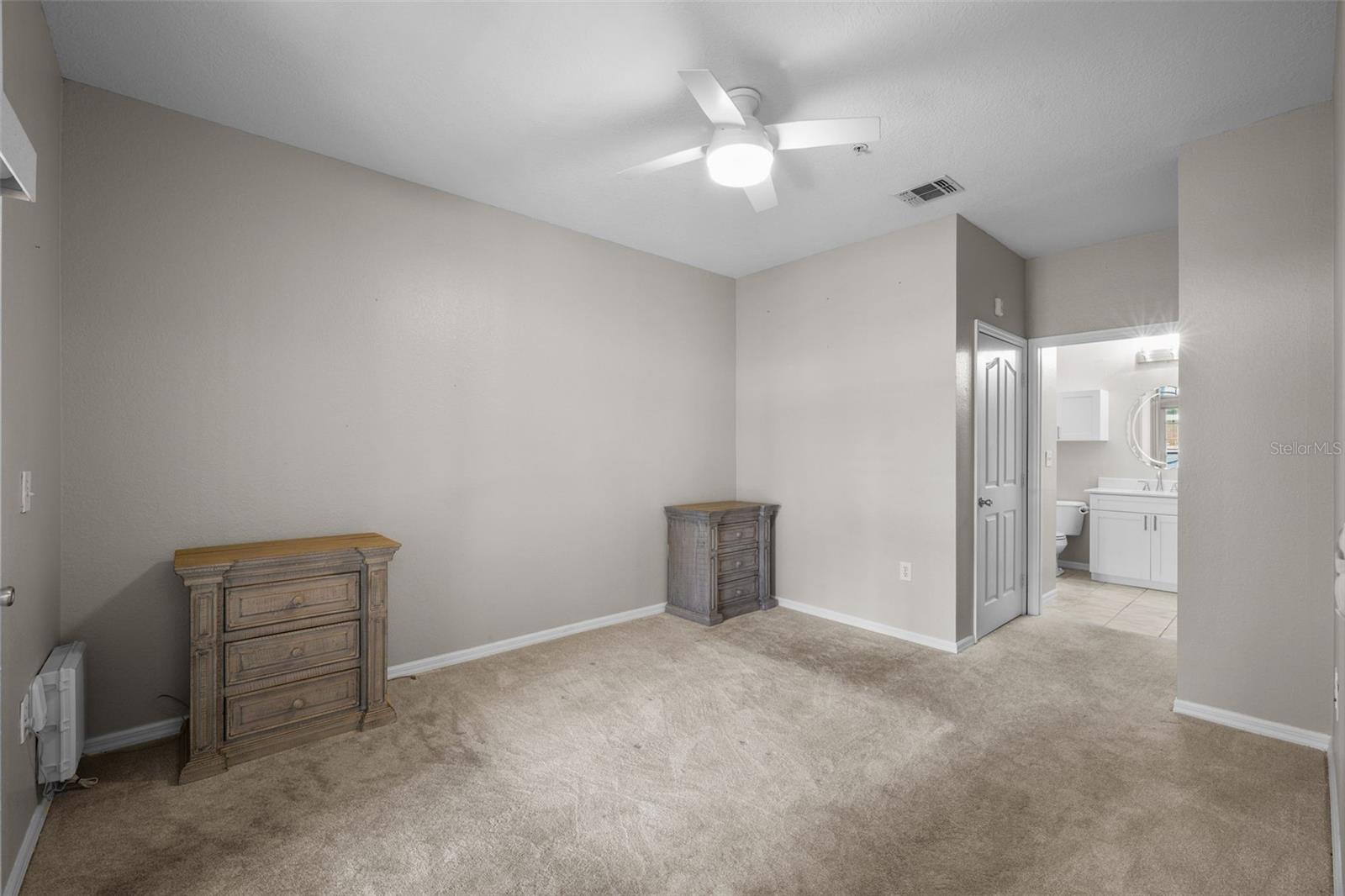 Master Bedroom with private bath and door to Patio.
