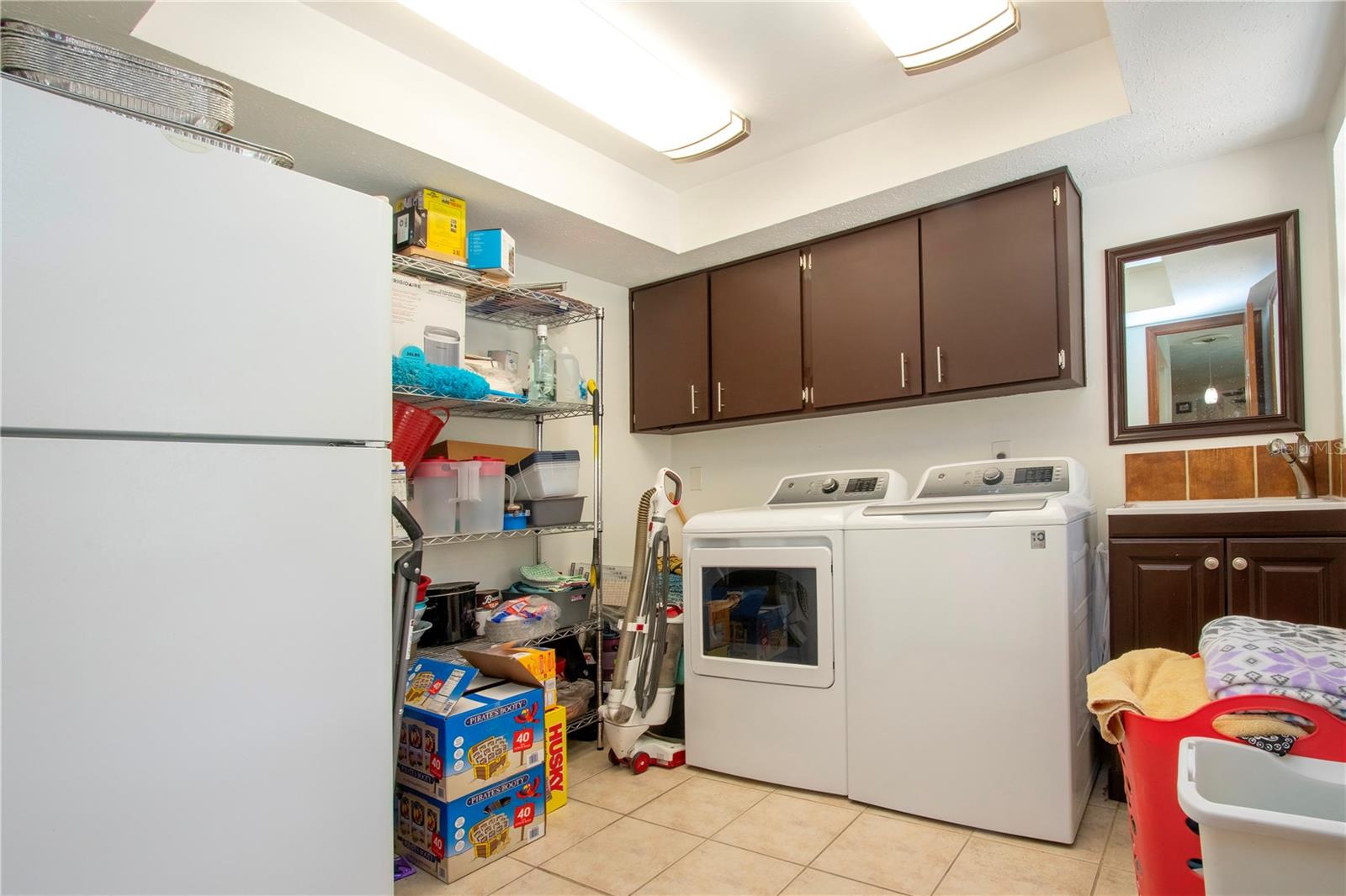 Laundry room right off the kitchen. Comes with the refrigerator!