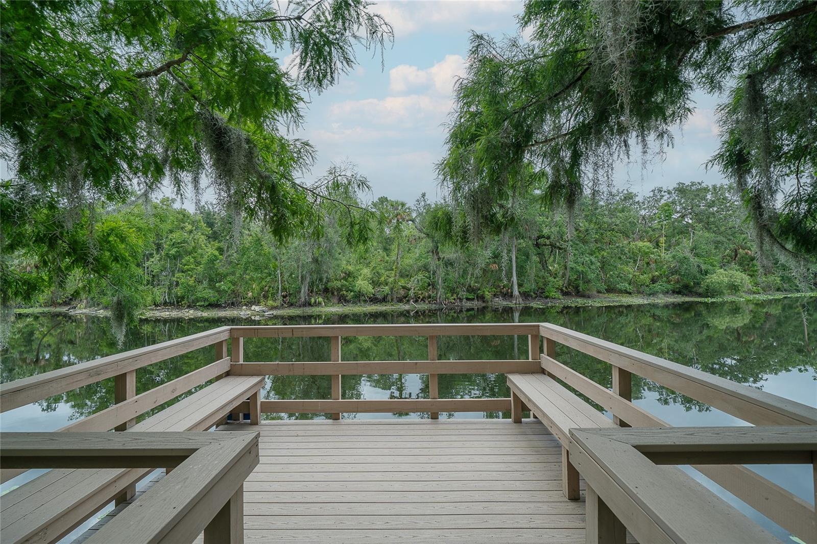 deck extending into river at park