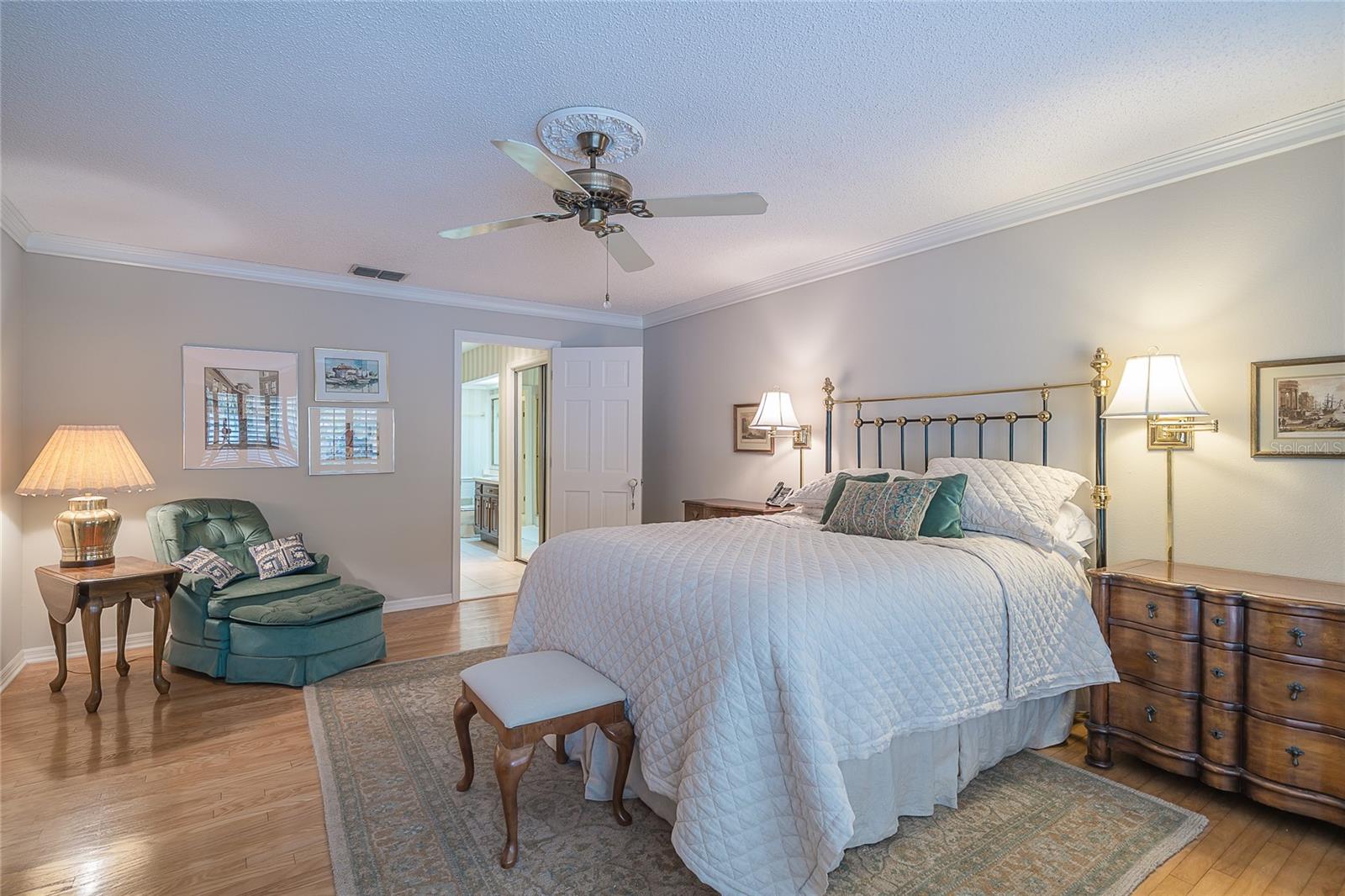 master bedroom with hardwood floors