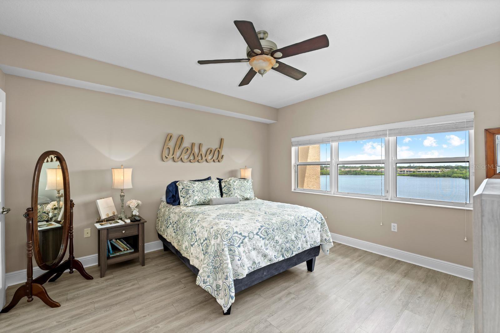 The oversized primary bedroom overlooks the water too! Picture yourself laying in bed everyday with this gorgeous water view!