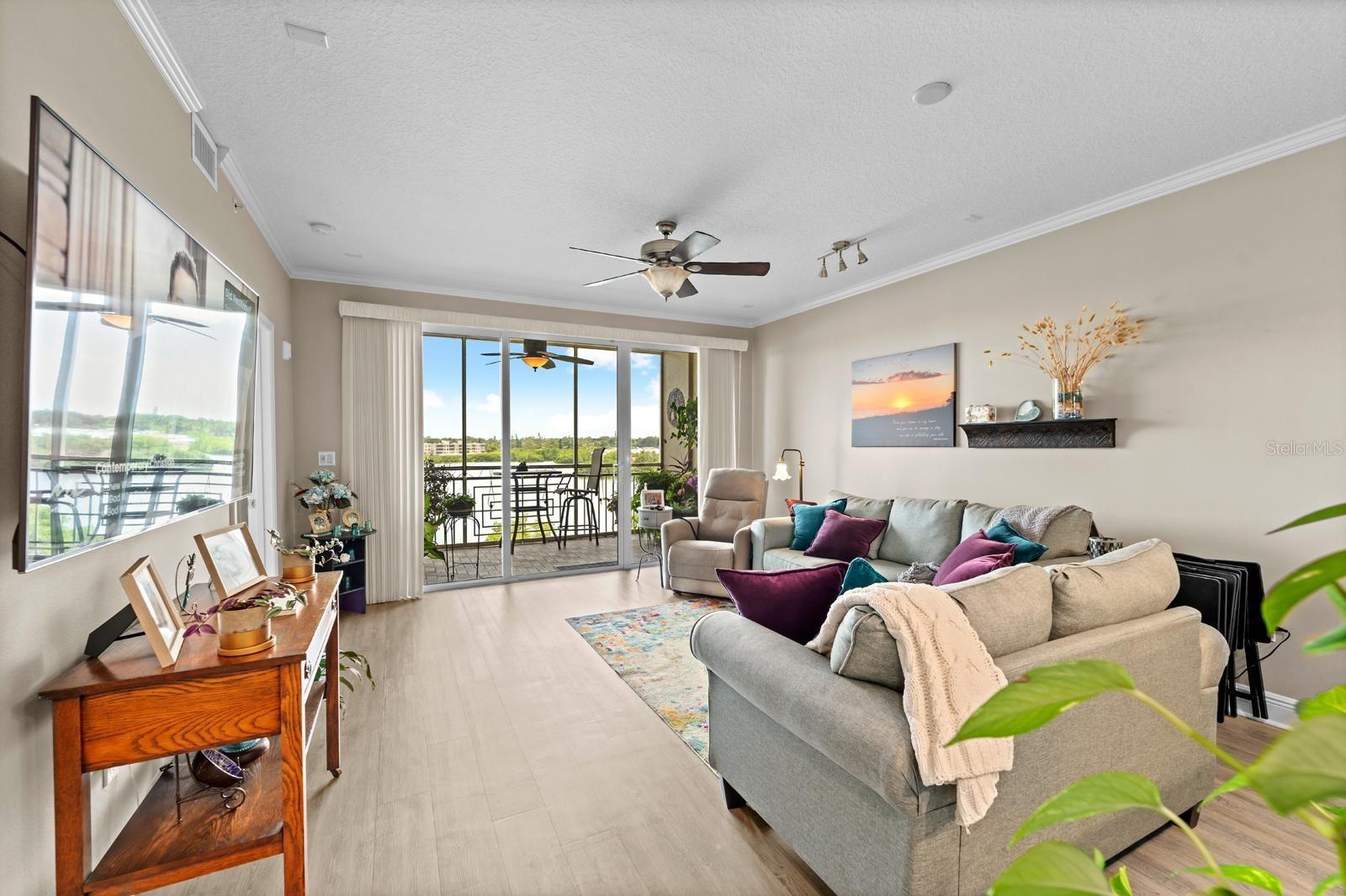 The large and spacious great room overlooks the water!  You can even see the water from the couch!