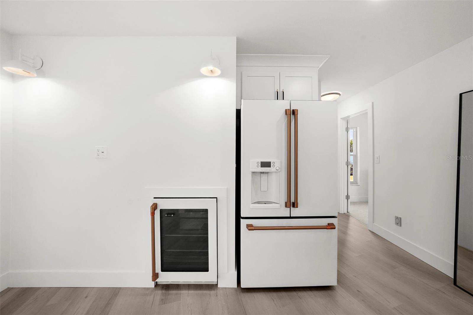 Beverage cooler with space on the wall for personalization - TV, wine rack, it's your's to decide! Lighting and electrical are currently in place!