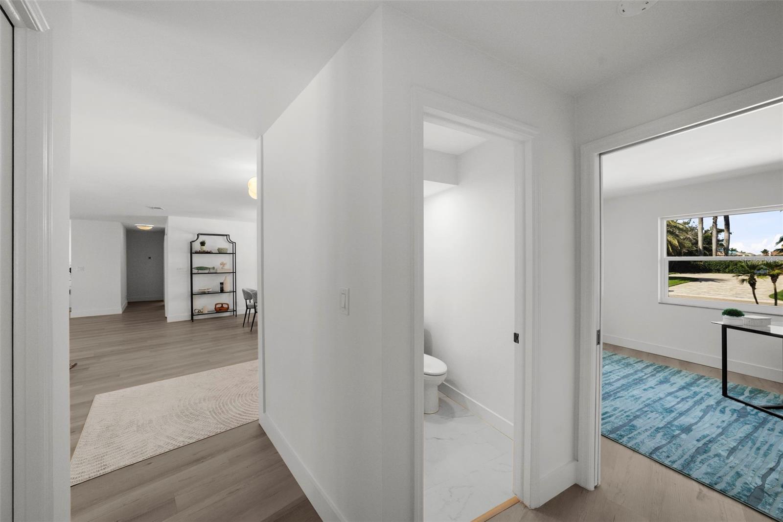 4th bedroom and 1/2 bath located next to primary bedroom.