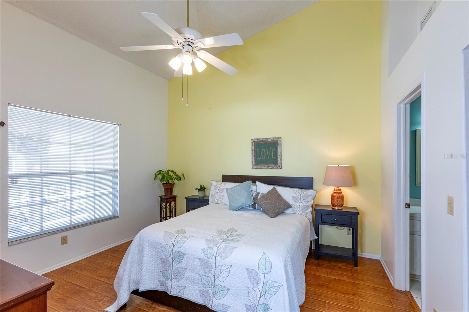 Primary Bedroom- high ceilings w ceiling fan