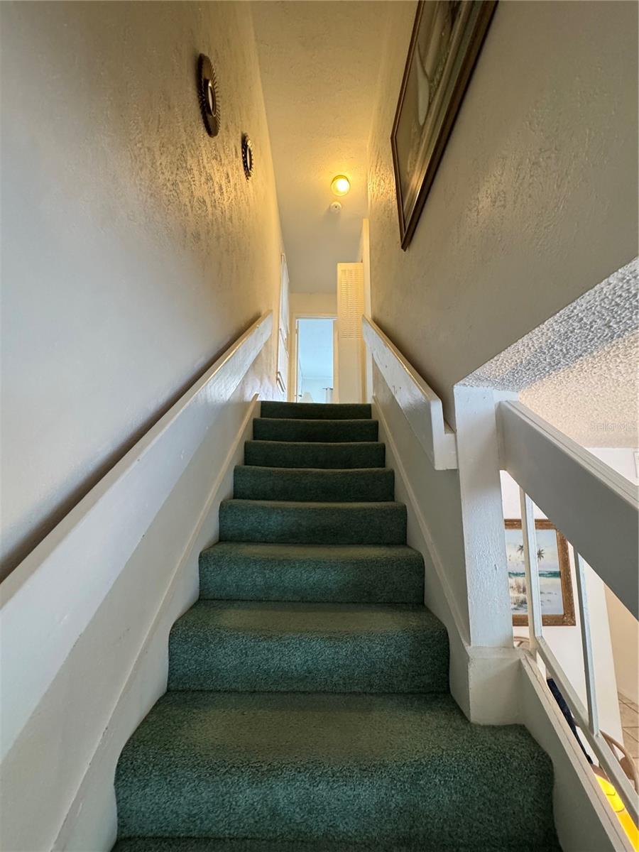 Stairs to bedrooms and laundry