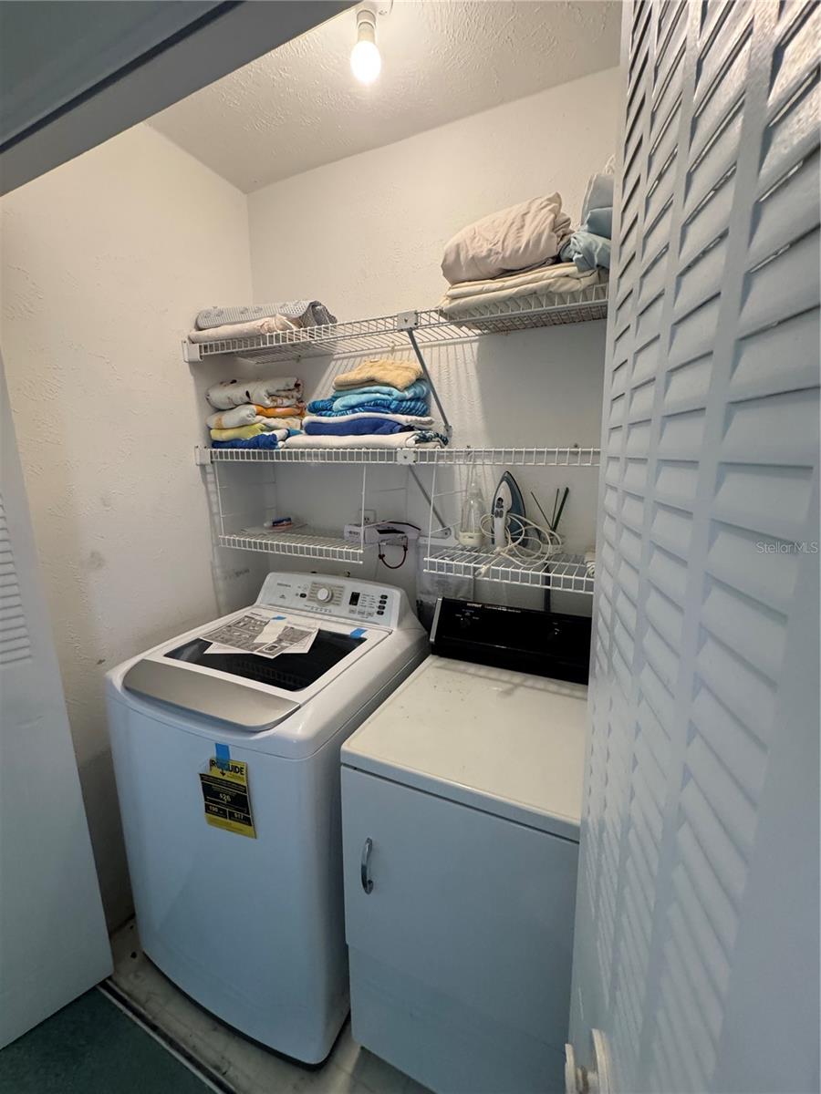 Laundry next to Primary bedroom