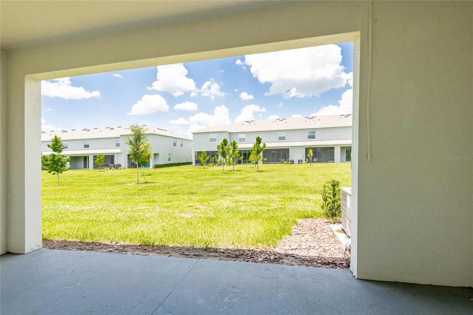 Back covered lanai faces a large common area which will not be developed.