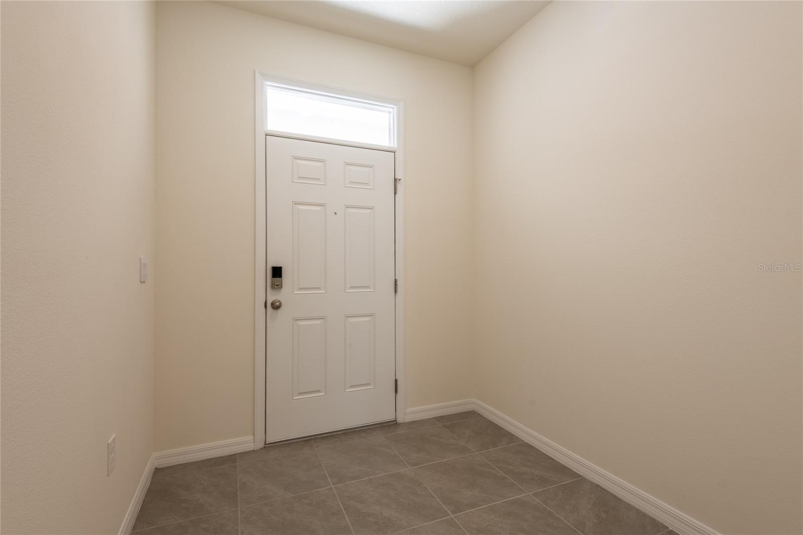 Large foyer with space for sofa table or storage cabinets