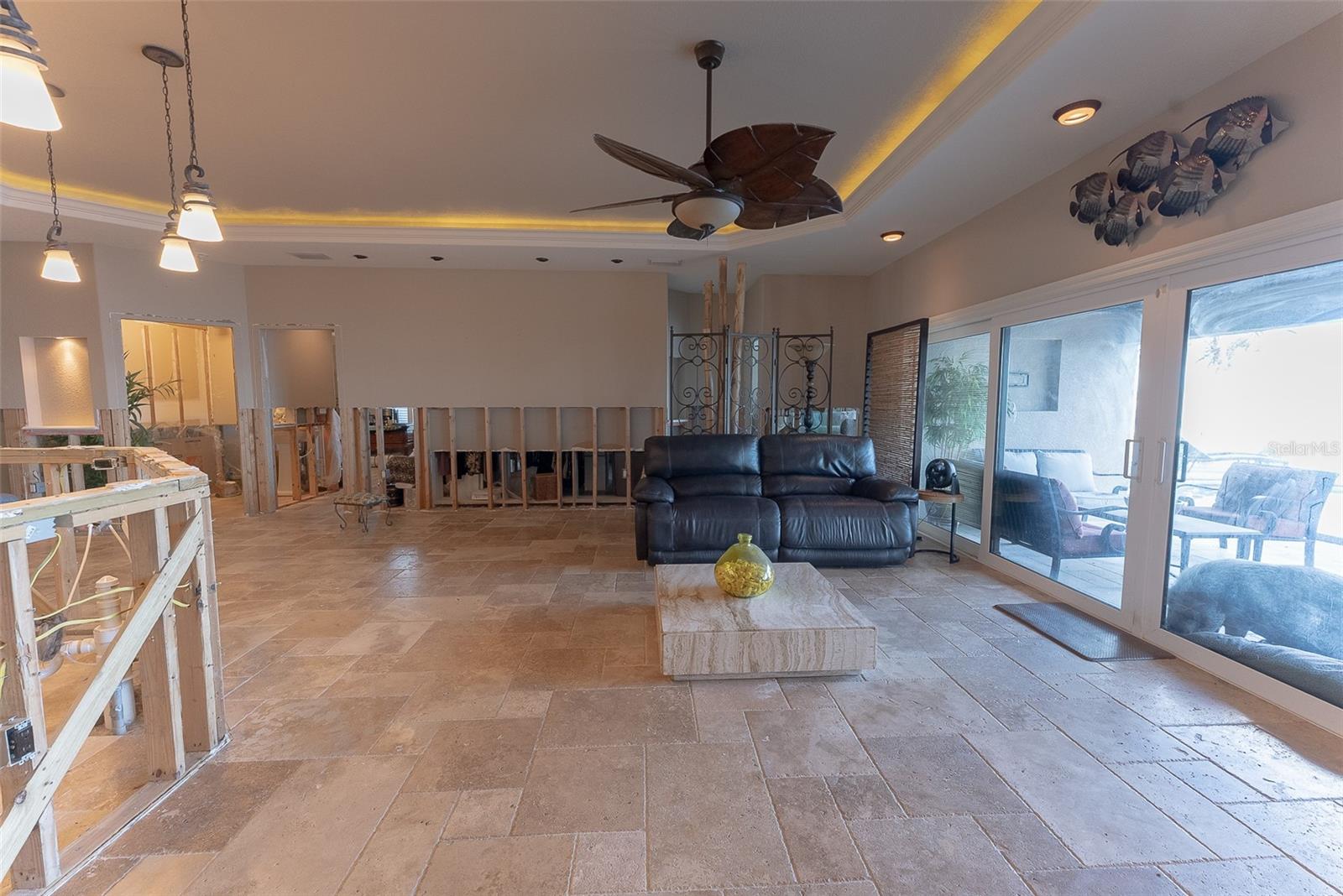 Living Room with Wall of Hurricane-Rated Sliding Glass Doors487 Harbor Dr S, Indian Rocks Beach, FL