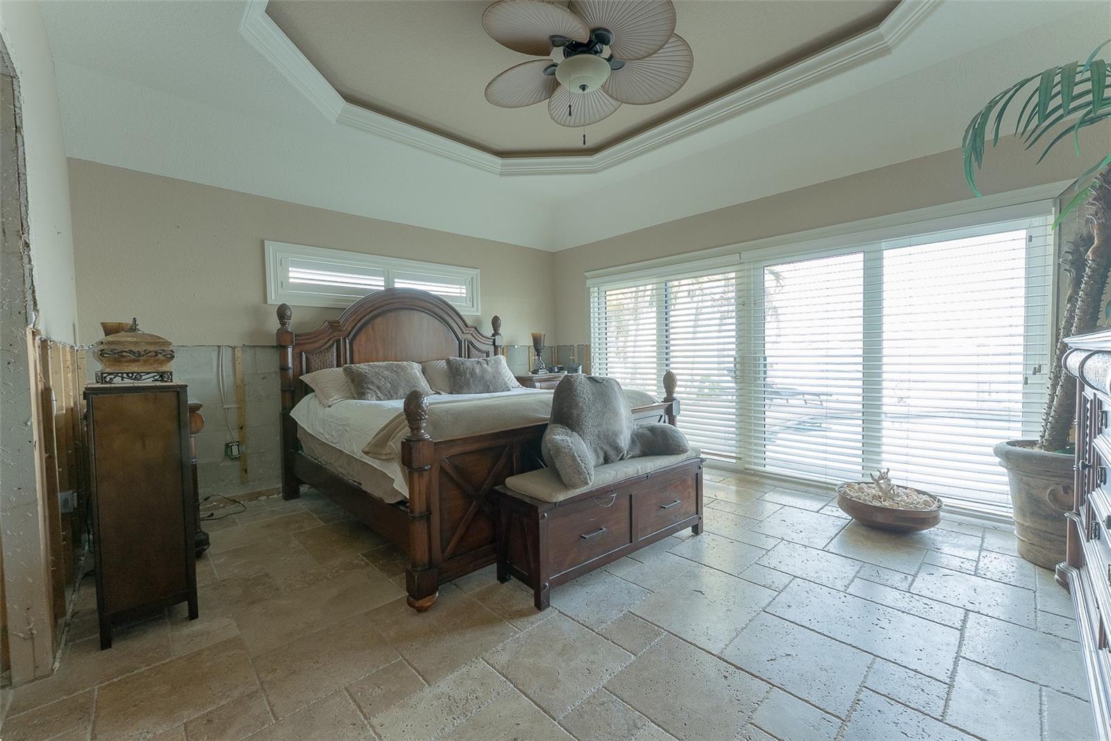 Primary Bedroom with Wall of Sliders Leading to Pool & Intracoastal487 Harbor Dr S, Indian Rocks Beach, FL