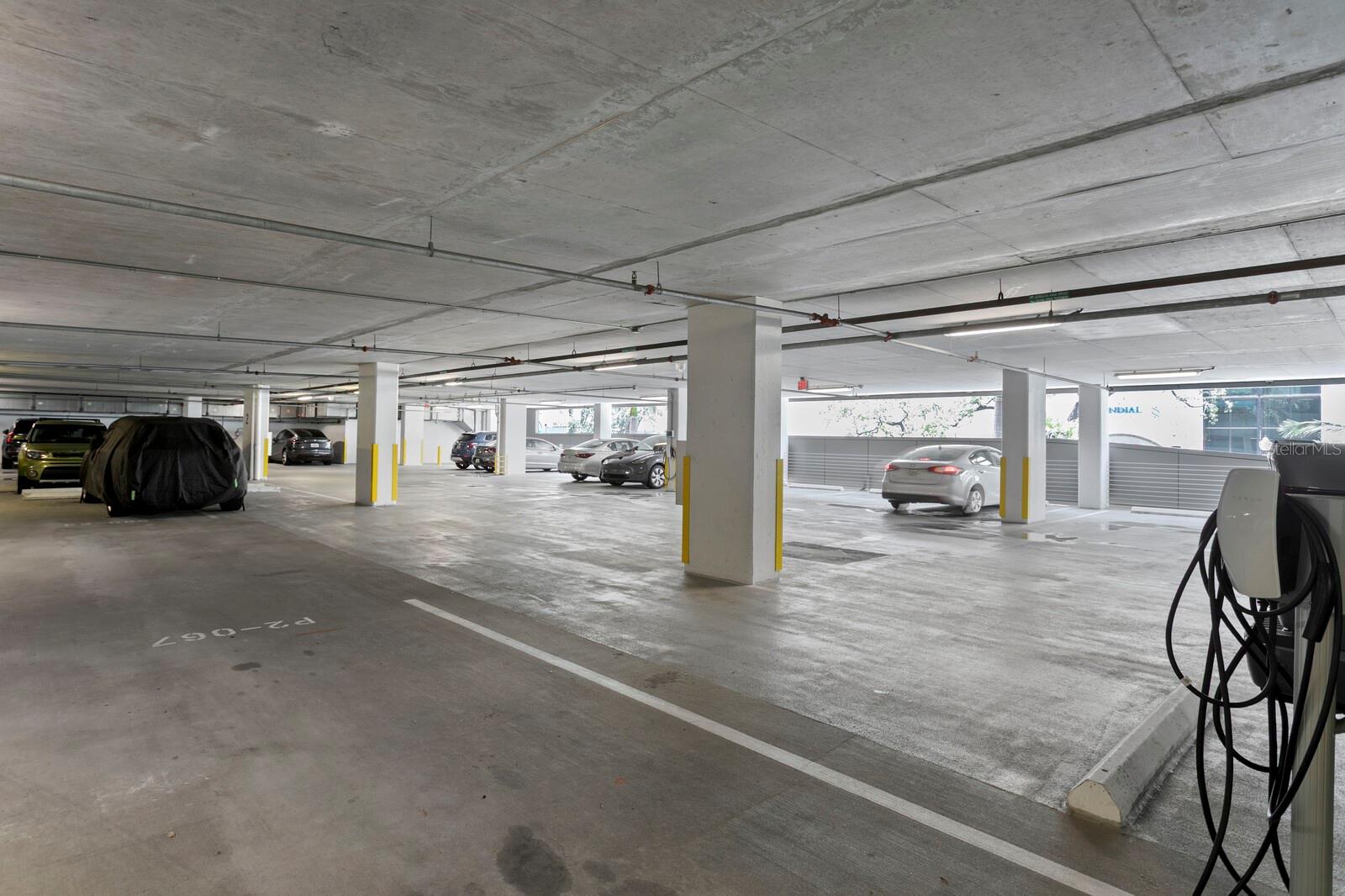 2 parking spaces on level 2 with EV charger