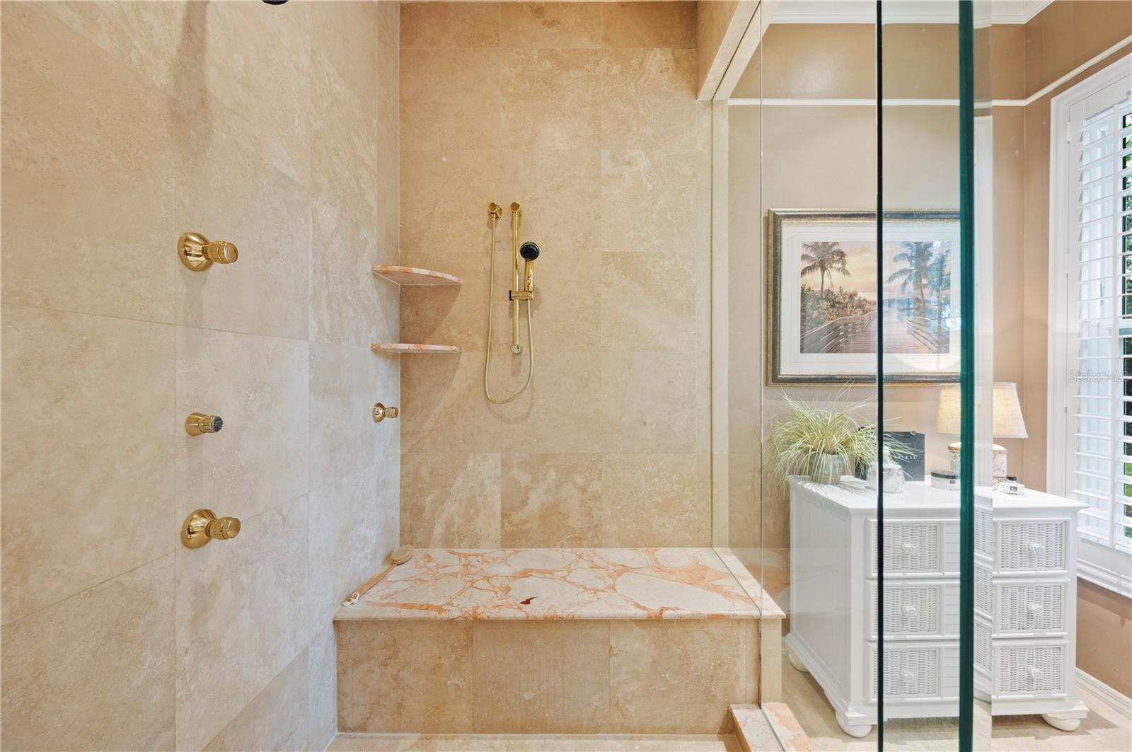 Lovely Walk in shower with multiple shower heads.