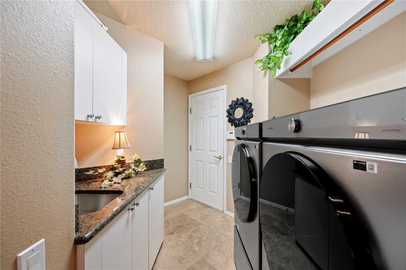 Laundry with folding table and cabinets