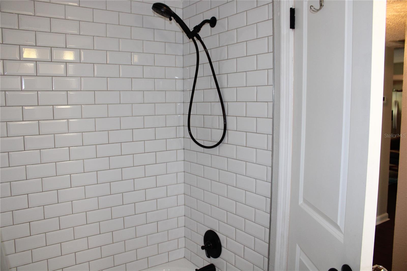 Guest bath has tub shower