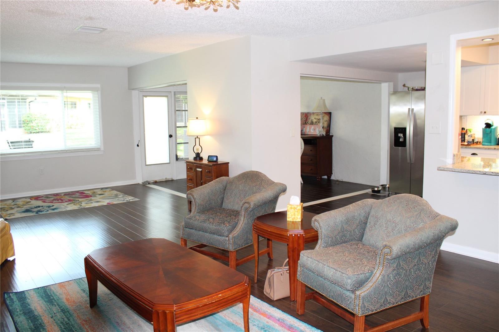 Family room looking towards dining room and patio door.