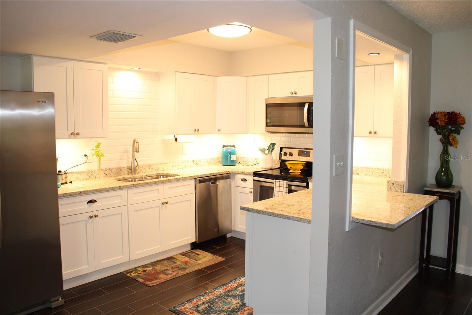 New kitchen and all matching Whirlpool stainless steel appliances.