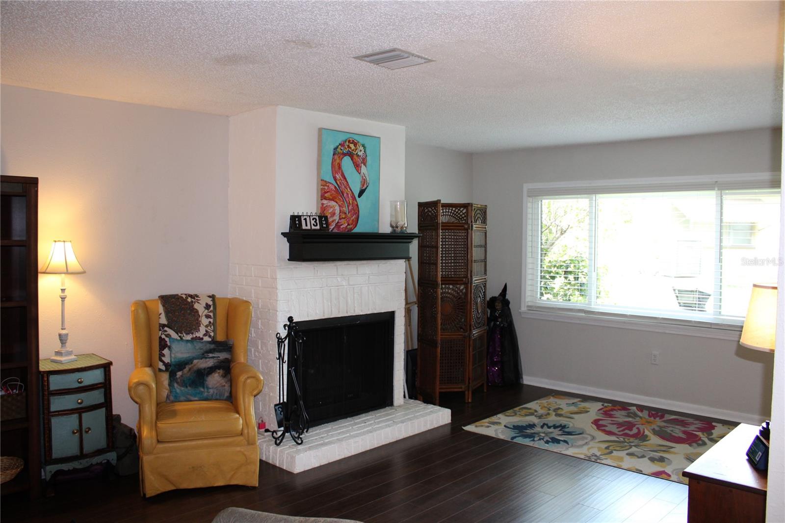 New Hurricane Impact glass windows. Real wood burning fireplace