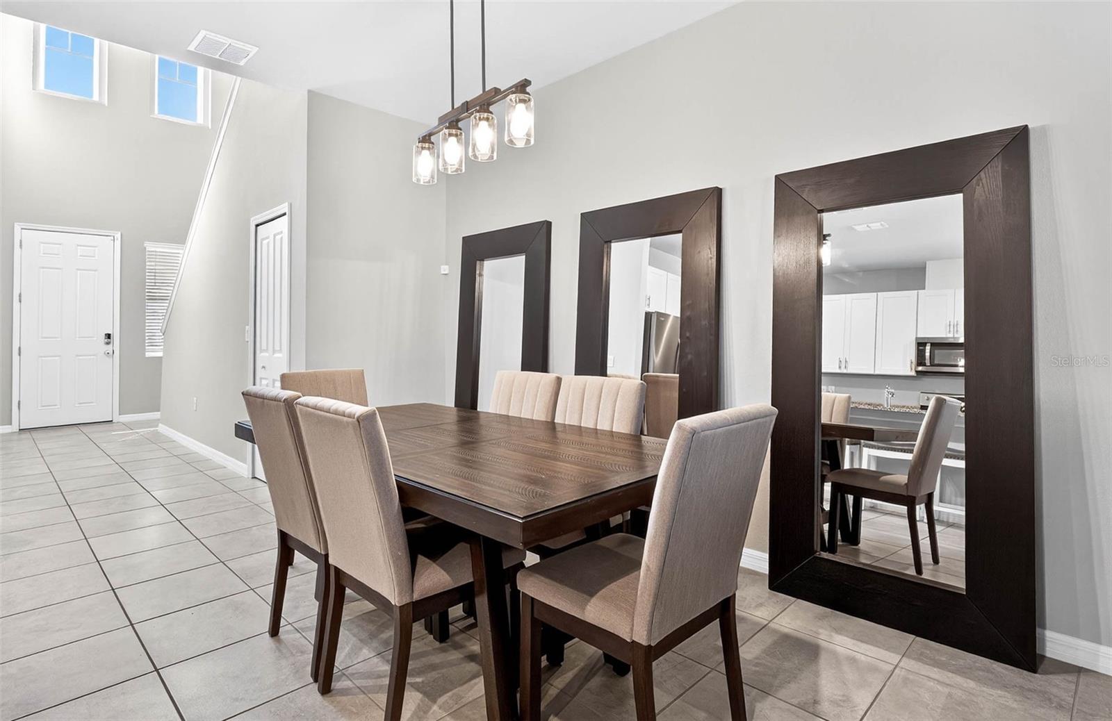 Stunning two-story entryway and ample dining room space.