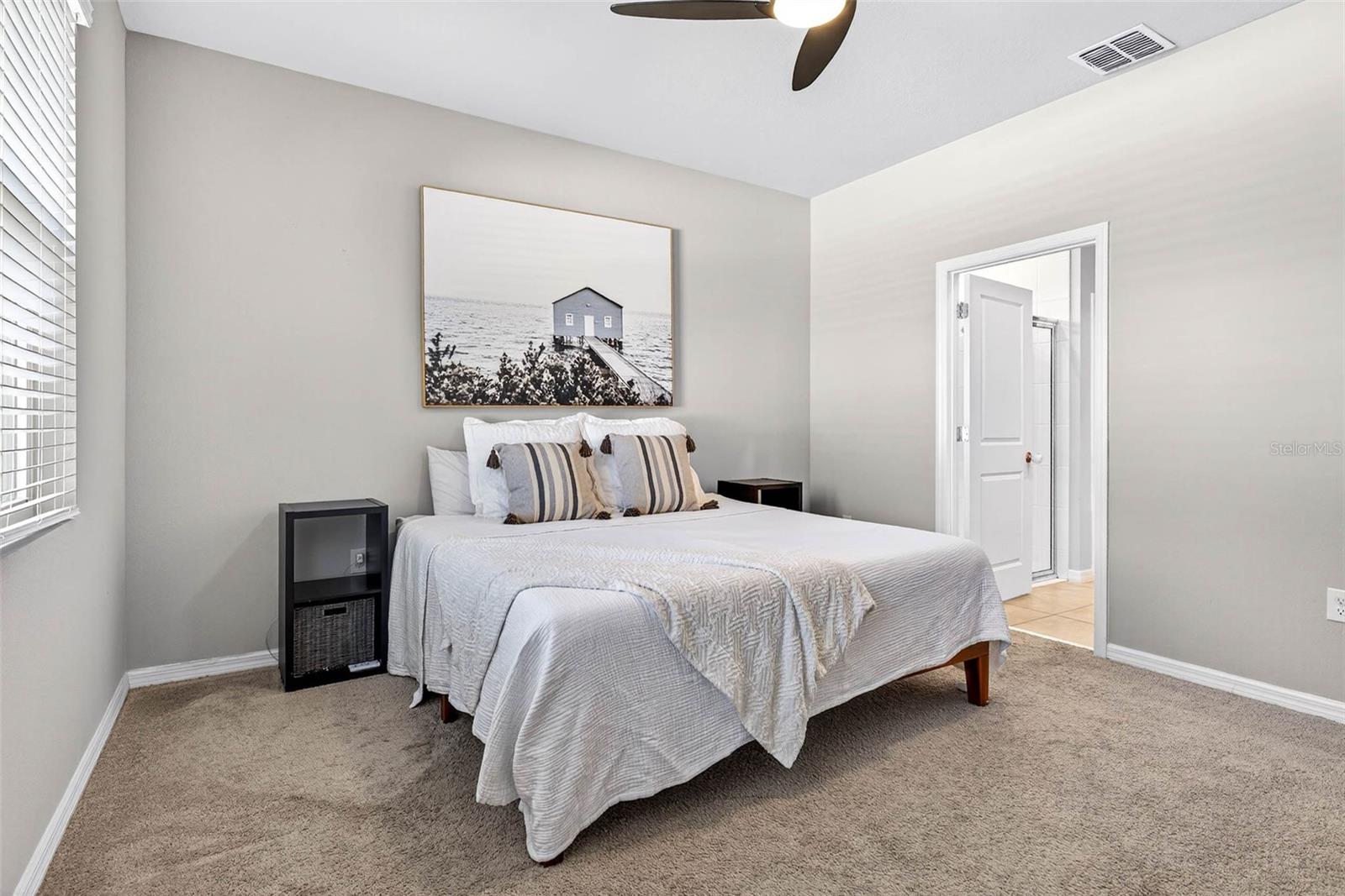 Primary suite on first floor has ensuite bath and walk in closet.