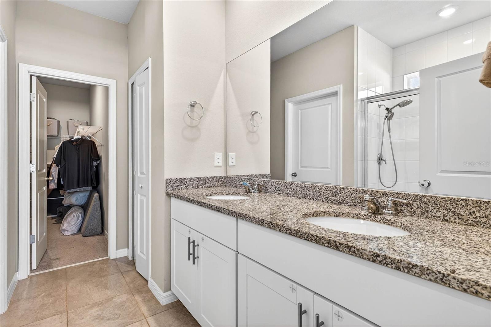 Dual sinks in the primary ensuite bath.