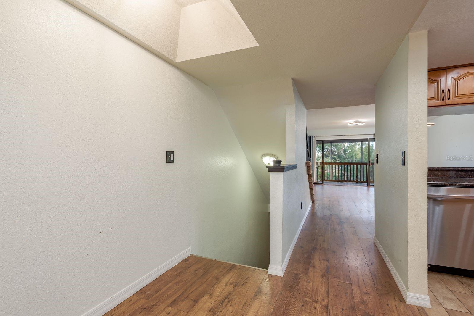 Stairs to second level from lower level bedroom