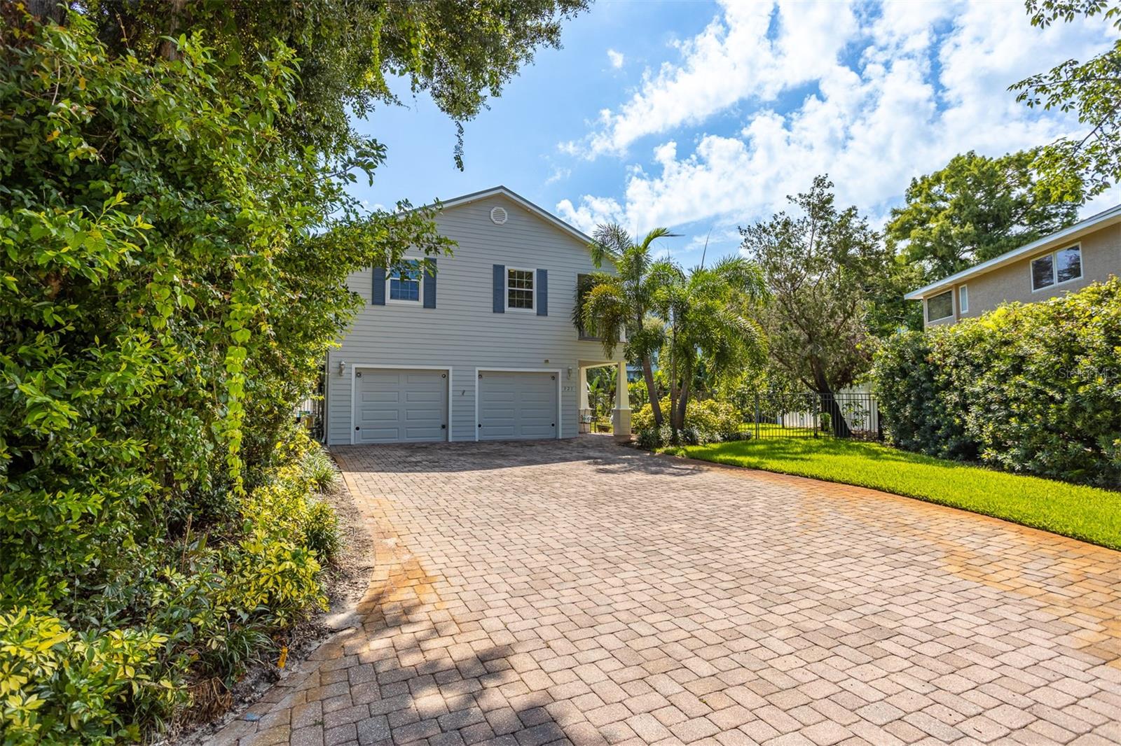 Large driveway to your spacious oversized two car garage with plenty of room for parking on driveway as well
