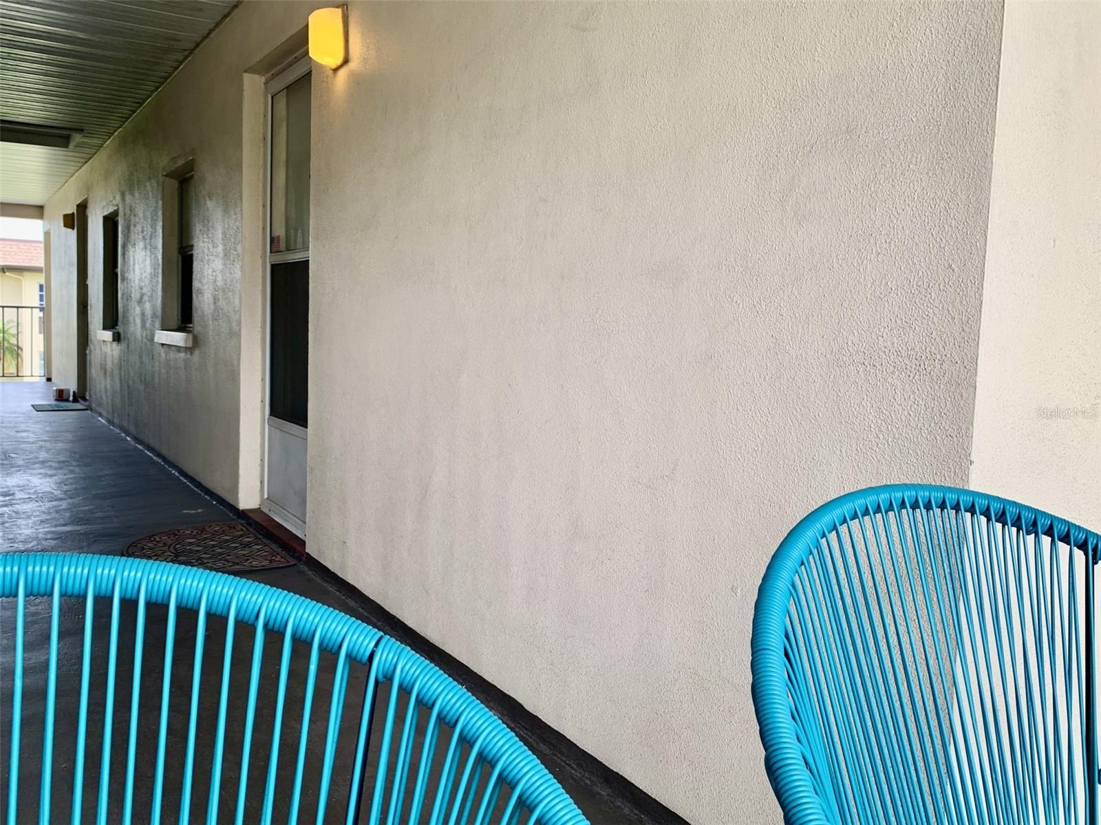 Owners have set up a couple chairs to enjoy the outside