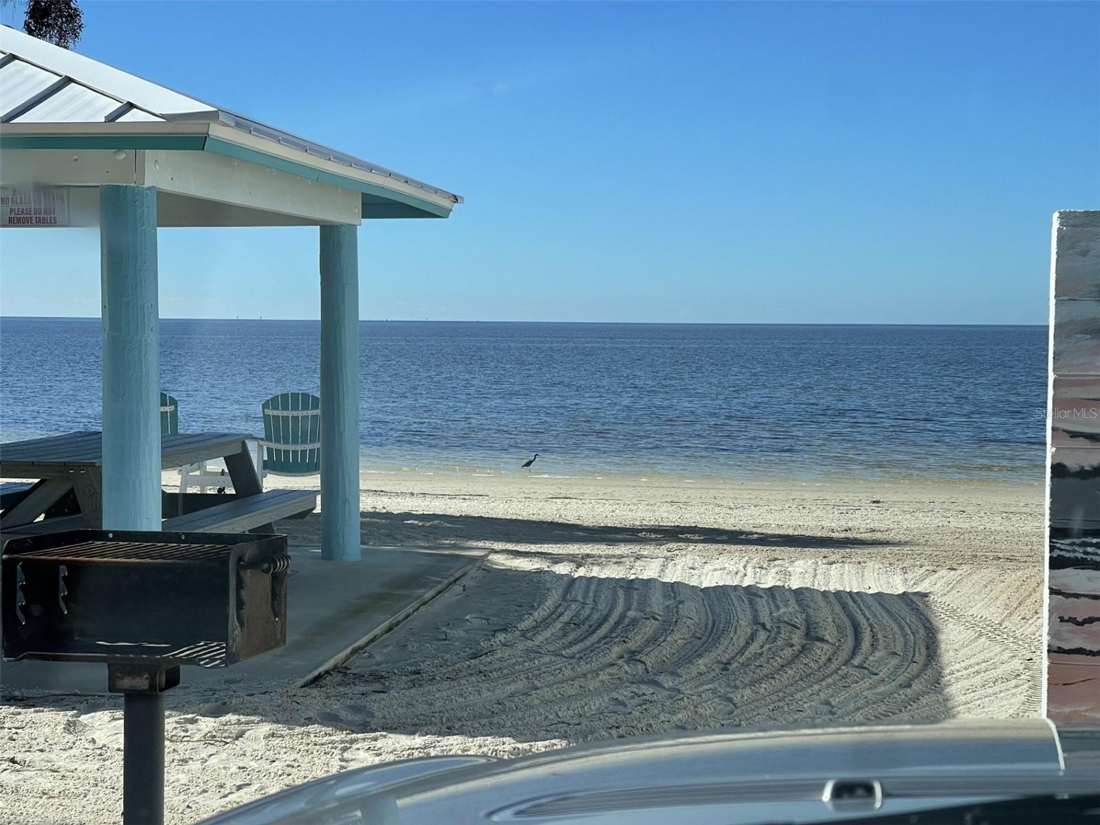 Private beach includes cabanas, parking, grills and restrooms