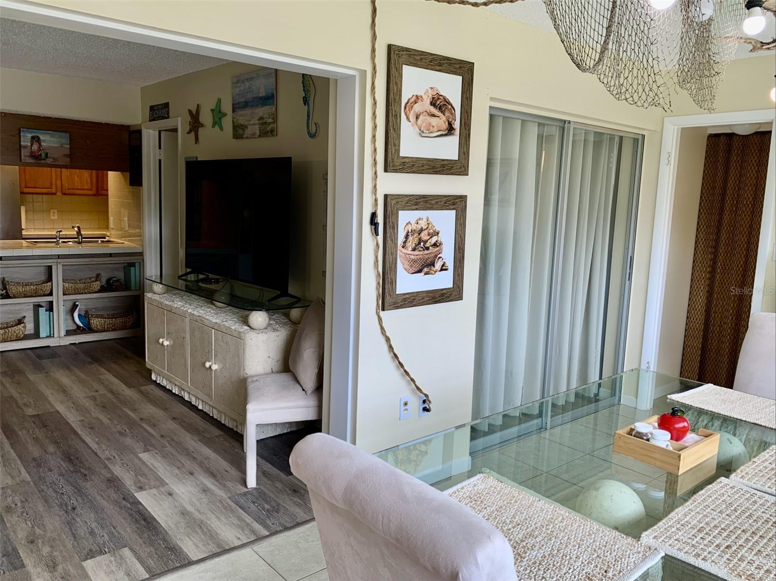 Florida room is large and bright. Some use the space as a 2nd bedroom. Current owner used as a large family dining room.
