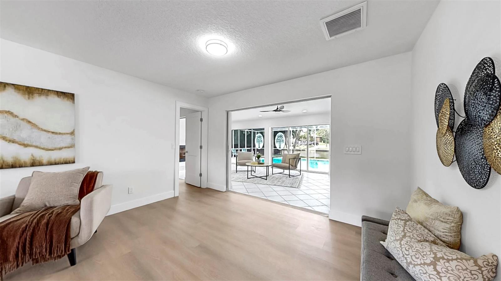 Flowy formal living room into Florida Room