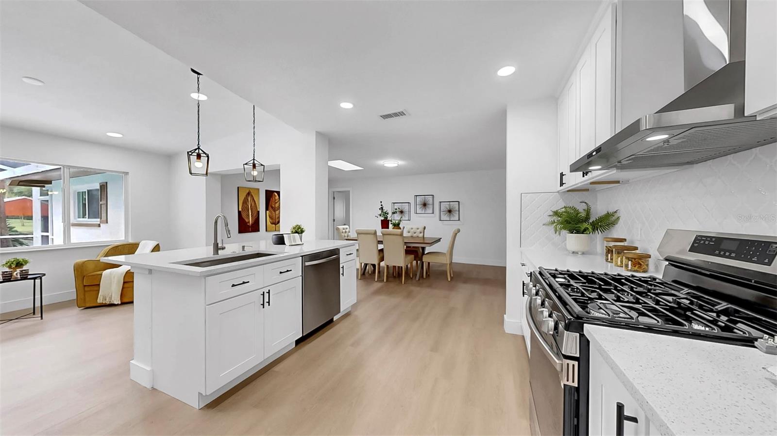 Kitchen opens to bonus space overlooking pool and waterfront!