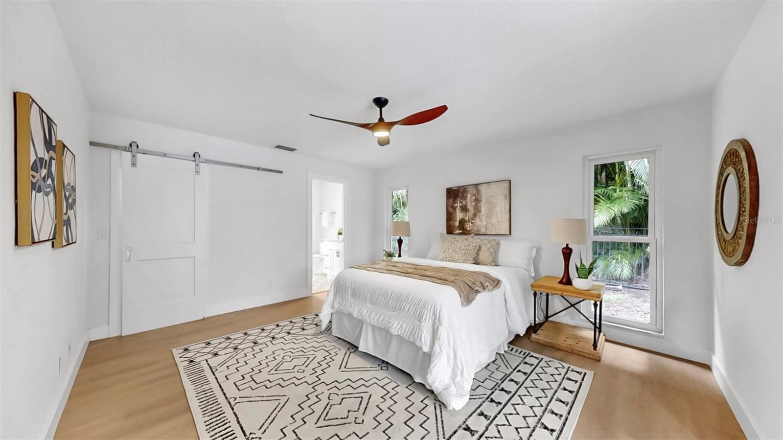 Spacious primary suite with walk-in closet and full bathroom.