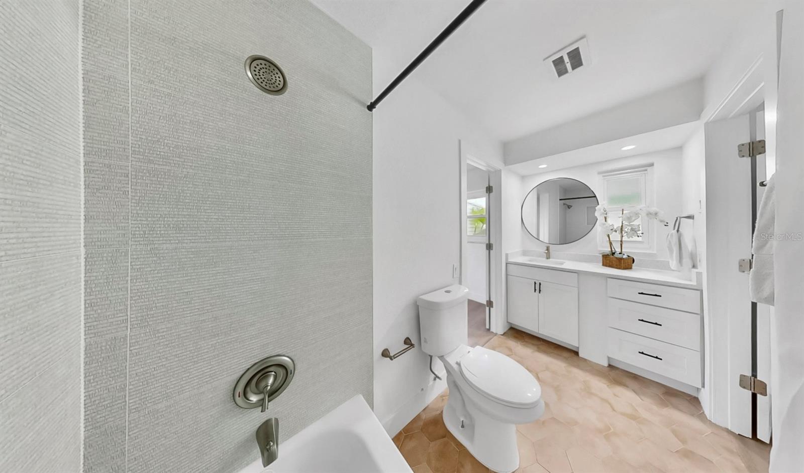 Jack & Jill bathroom between two spacious bedrooms.