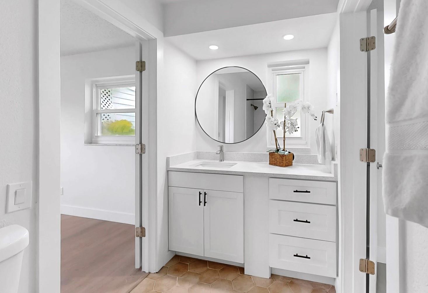 Jack & Jill bathroom between two spacious