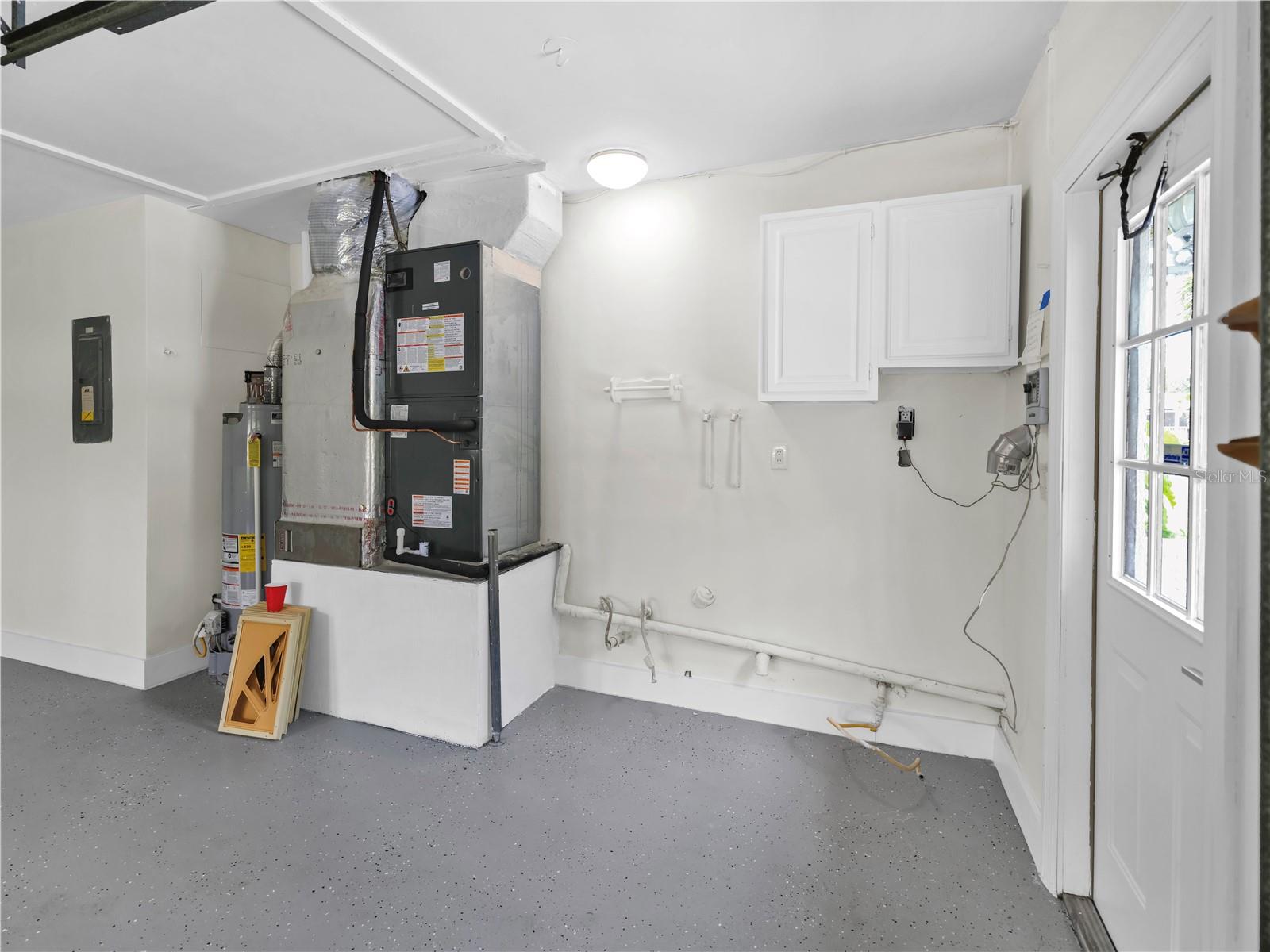 Newly update AC. Door leading from Garage to backyard/parking pad.