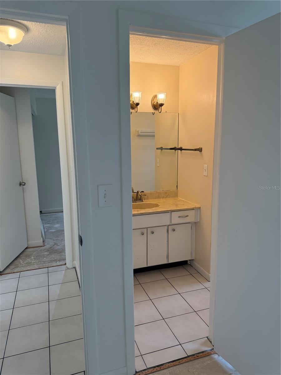 En suite bathroom also has door to hall