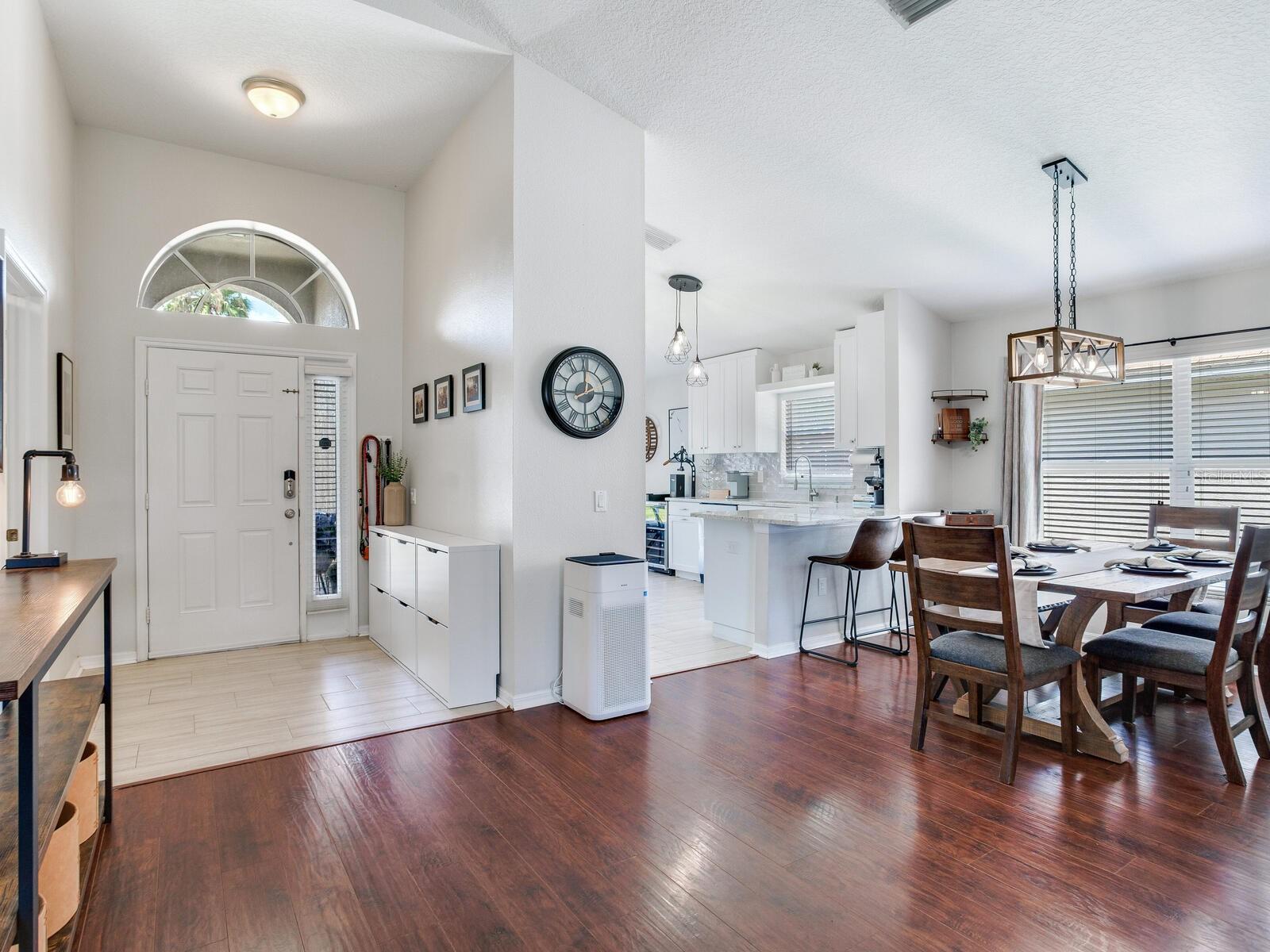Foyer (left) / Dining / Kitchen (right)