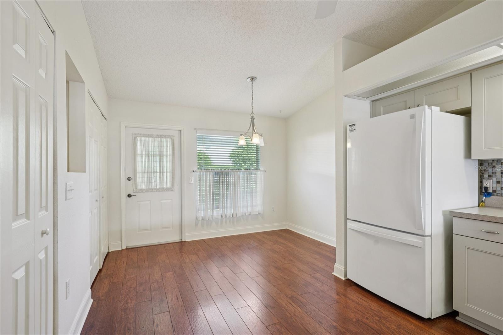 Dinette Space in Kitchen - Back door leads outside to Exterior Storage