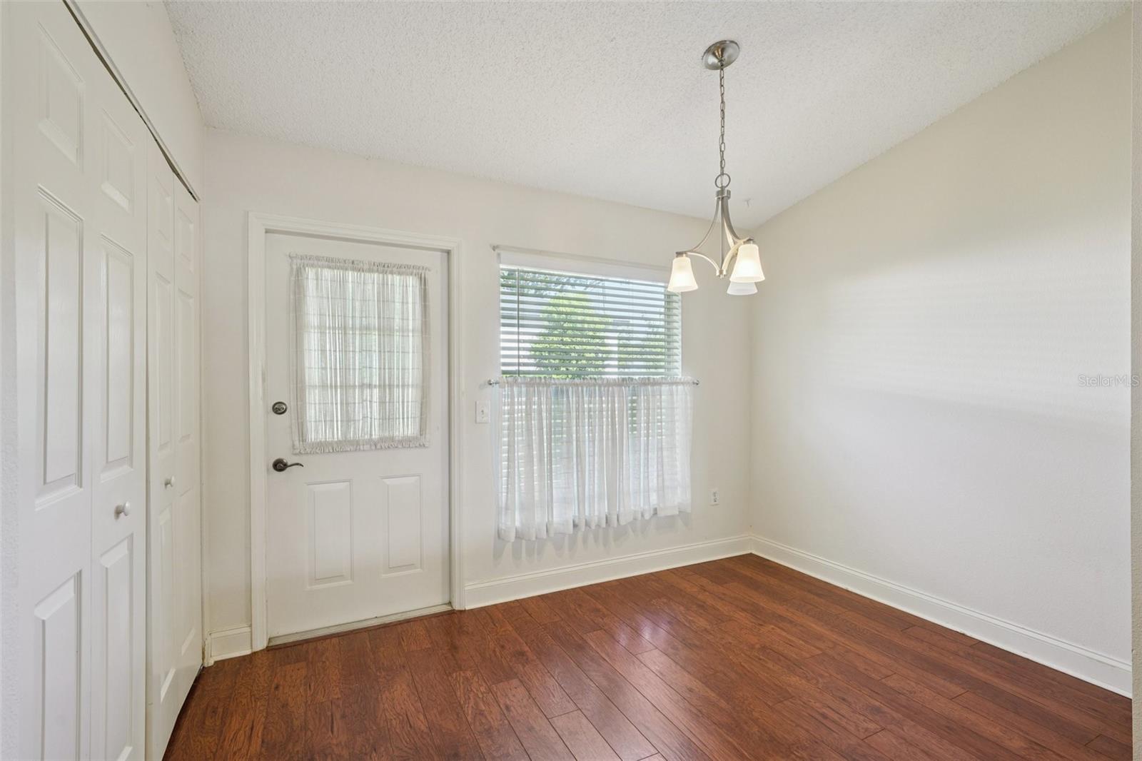 Dinette Space in Kitchen - Back door leads outside to Exterior Storage